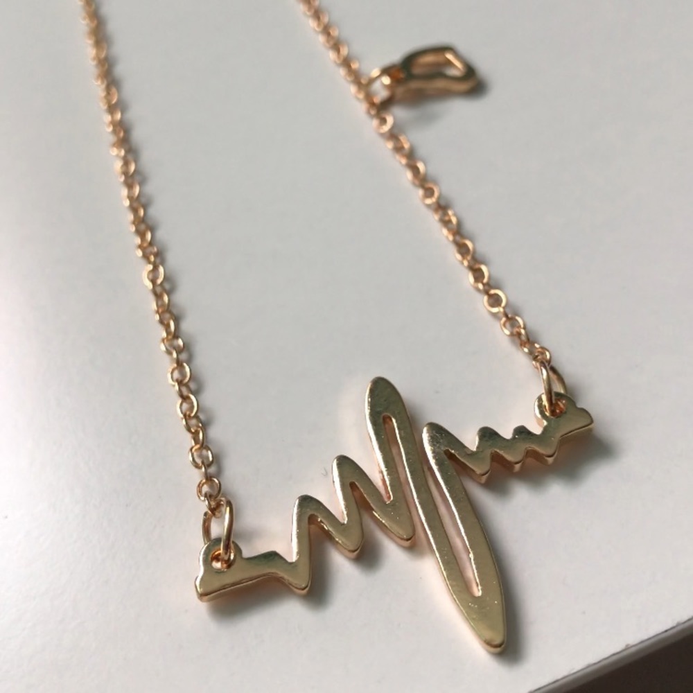 Gold heartbeat necklace